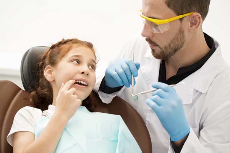 shutterstock_1022954143 - Happy Pediatric Dentistry